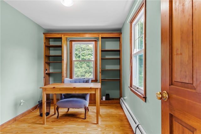 140 Long Hwy, Little Compton, RI 02837 - office area with baseboard heating, healthy amount of natural light, and light wood-type flooring