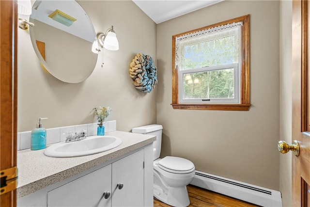 140 Long Hwy, Little Compton, RI 02837 - bathroom with a baseboard heating unit, vanity, and wood finished floors