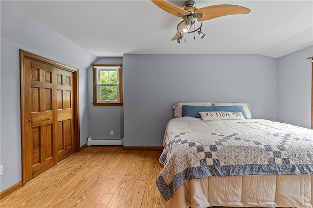 140 Long Hwy, Little Compton, RI 02837 - bedroom featuring a baseboard radiator, lofted ceiling, light wood-type flooring, and a ceiling fan