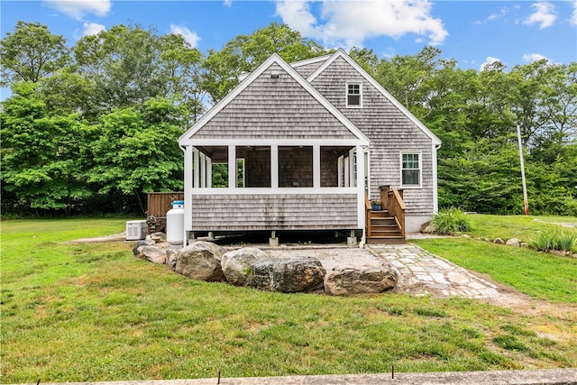 140 Long Hwy, Little Compton, RI 02837 - view of front facade with a sunroom and a front lawn