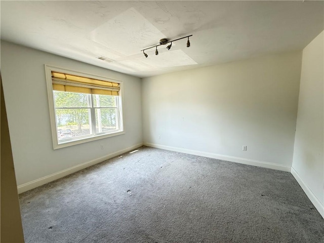 77 Batcheller Ave, Cranston, RI 02920 - carpeted empty room with rail lighting and baseboards