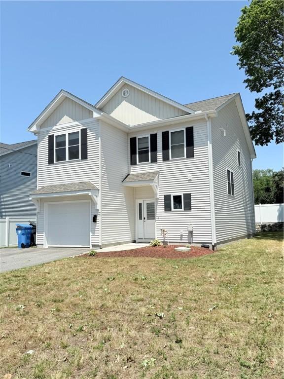 77 Batcheller Ave, Cranston, RI 02920 - view of front of home featuring a garage, driveway, and board and batten siding