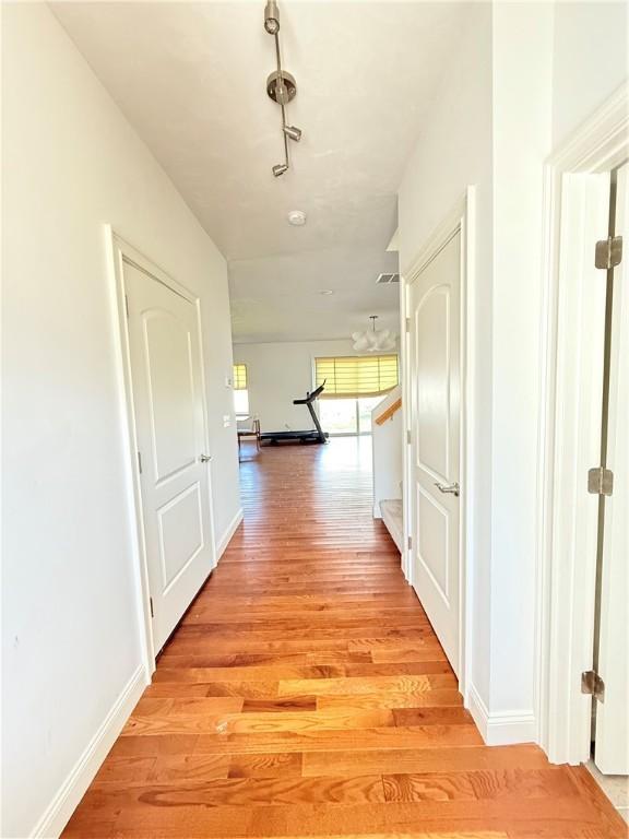 77 Batcheller Ave, Cranston, RI 02920 - corridor featuring light wood-type flooring