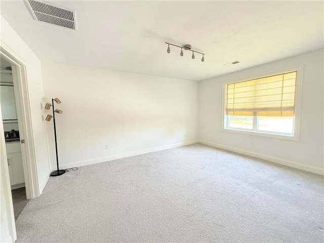 77 Batcheller Ave, Cranston, RI 02920 - empty room with light carpet and rail lighting