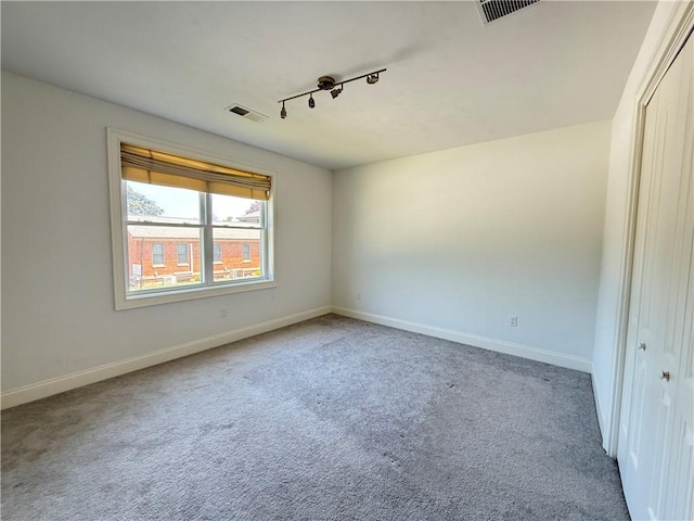 77 Batcheller Ave, Cranston, RI 02920 - carpeted spare room with baseboards and rail lighting