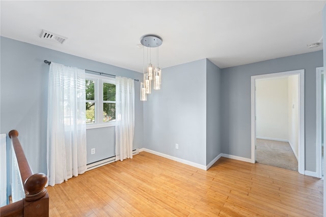 22 Riverdale Rd, Westerly, RI 02891 - unfurnished dining area with light wood-style flooring, baseboard heating, and a chandelier