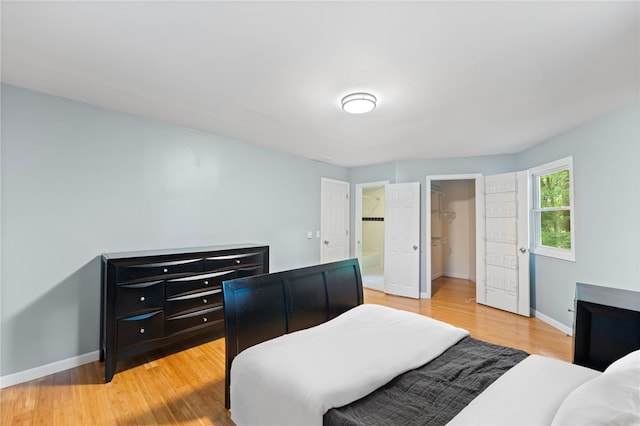 22 Riverdale Rd, Westerly, RI 02891 - bedroom featuring light wood-type flooring, a walk in closet, and a closet