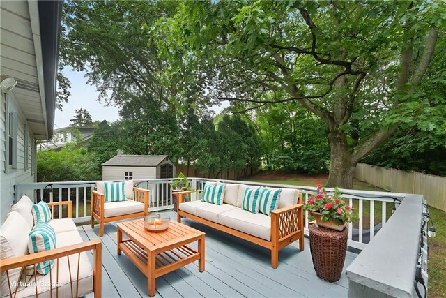 22 Riverdale Rd, Westerly, RI 02891 - wooden terrace with an outdoor living space, a storage unit, and a fenced backyard
