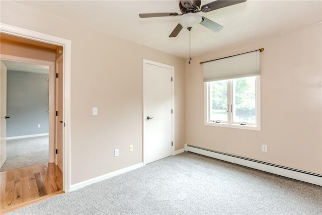 422 Buxton St, North Smithfield, RI 02896 - unfurnished bedroom with baseboard heating, carpet floors, and a ceiling fan
