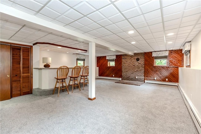 422 Buxton St, North Smithfield, RI 02896 - basement with wooden walls, a baseboard radiator, carpet, plenty of natural light, and recessed lighting