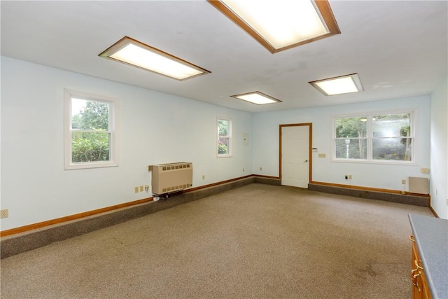 422 Buxton St, North Smithfield, RI 02896 - carpeted empty room featuring heating unit and baseboards