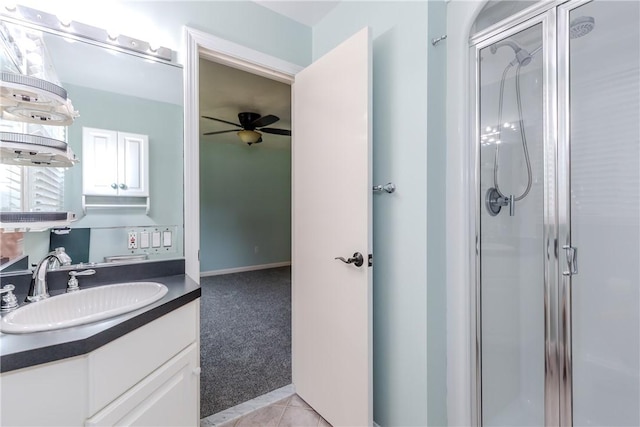 422 Buxton St, North Smithfield, RI 02896 - full bathroom with a shower stall, ceiling fan, vanity, and tile patterned flooring