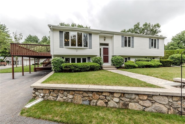 422 Buxton St, North Smithfield, RI 02896 - raised ranch featuring driveway, a carport, a wooden deck, and a front yard