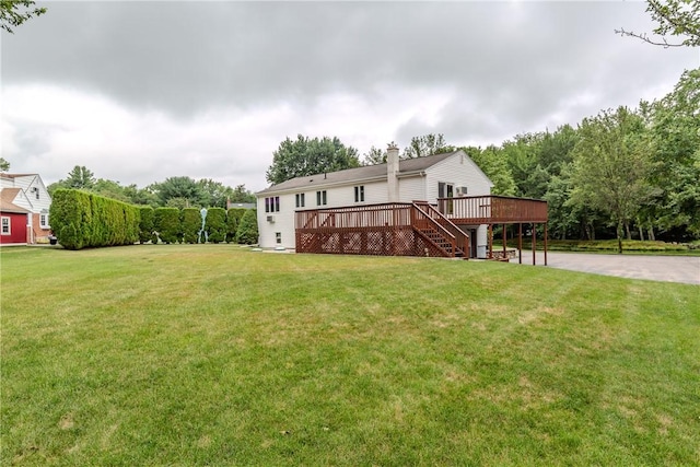 422 Buxton St, North Smithfield, RI 02896 - view of green lawn with a wooden deck, driveway, and stairway