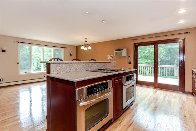 422 Buxton St, North Smithfield, RI 02896 - kitchen featuring stainless steel oven, a baseboard heating unit, light wood-type flooring, a chandelier, and recessed lighting