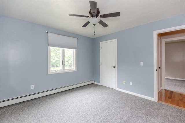 422 Buxton St, North Smithfield, RI 02896 - unfurnished bedroom featuring a baseboard heating unit, carpet flooring, and ceiling fan