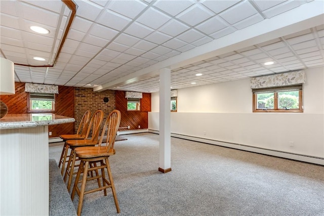 422 Buxton St, North Smithfield, RI 02896 - indoor bar with baseboard heating, wooden walls, carpet floors, recessed lighting, and a baseboard radiator
