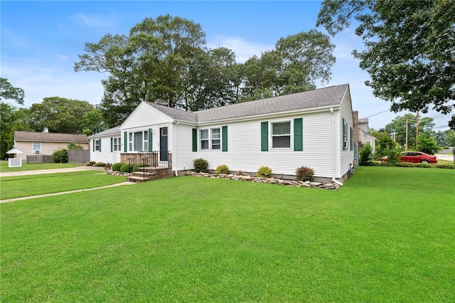 67 Vera St, Warwick, RI 02886 - manufactured / mobile home featuring a front yard and roof with shingles
