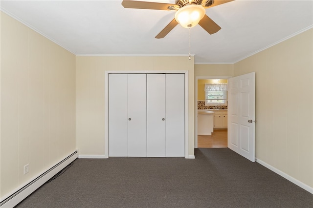 67 Vera St, Warwick, RI 02886 - unfurnished bedroom with baseboard heating, crown molding, dark carpet, a closet, and ceiling fan