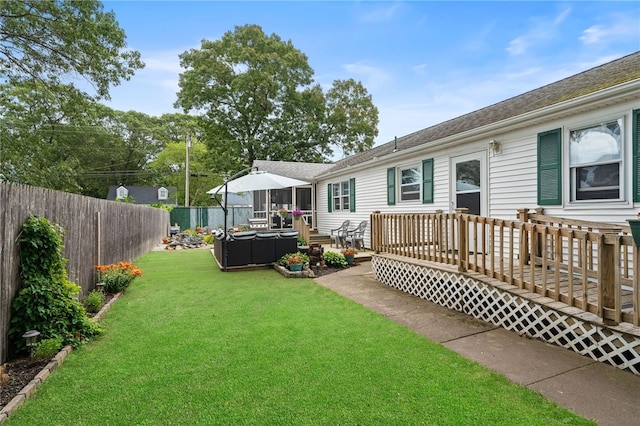67 Vera St, Warwick, RI 02886 - fenced backyard featuring a deck and outdoor lounge area