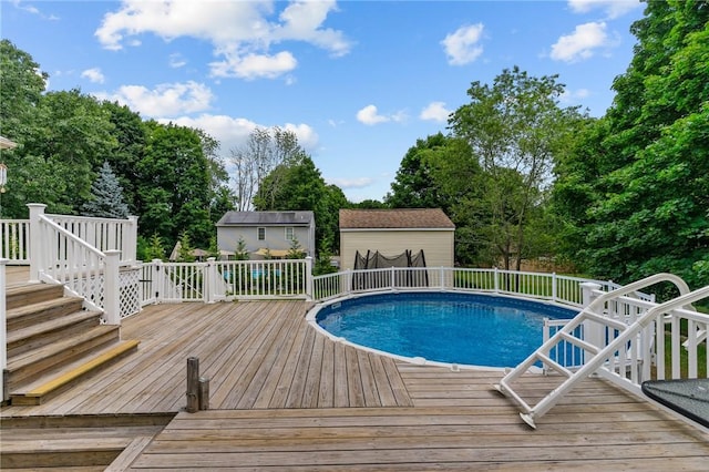 203 Pulaski St, West Warwick, RI 02893 - view of swimming pool featuring a wooden deck and view of scattered trees
