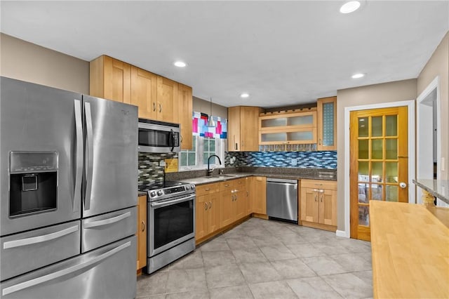 203 Pulaski St, West Warwick, RI 02893 - kitchen with appliances with stainless steel finishes, tasteful backsplash, glass insert cabinets, recessed lighting, and wooden counters