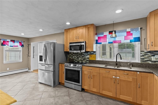 203 Pulaski St, West Warwick, RI 02893 - kitchen with stainless steel appliances, a baseboard radiator, plenty of natural light, backsplash, and recessed lighting