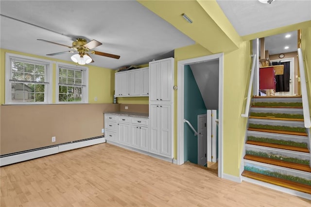 203 Pulaski St, West Warwick, RI 02893 - kitchen with a baseboard radiator, white cabinetry, ceiling fan, light wood-type flooring, and recessed lighting