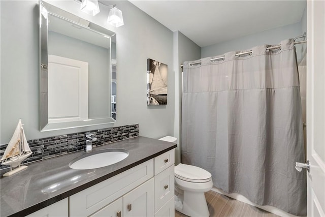 100 Algonquin Rd Unit 13, Narragansett, RI 02882 - full bathroom featuring vanity, tasteful backsplash, a shower with shower curtain, and wood finished floors