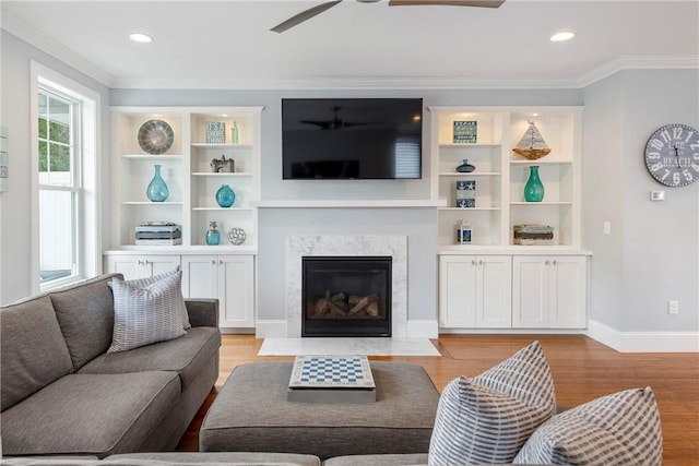 100 Algonquin Rd Unit 13, Narragansett, RI 02882 - living room featuring crown molding, a ceiling fan, light wood-type flooring, a high end fireplace, and recessed lighting