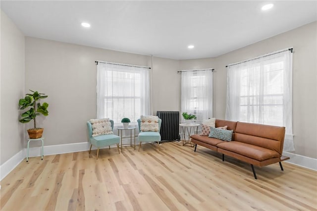 1413 Broad St, Providence, RI 02905 - sitting room featuring healthy amount of natural light, wood finished floors, radiator, and recessed lighting