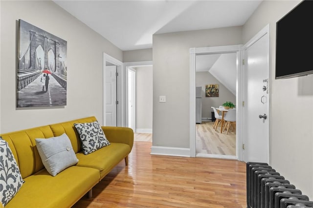 1413 Broad St, Providence, RI 02905 - living room featuring radiator and wood finished floors