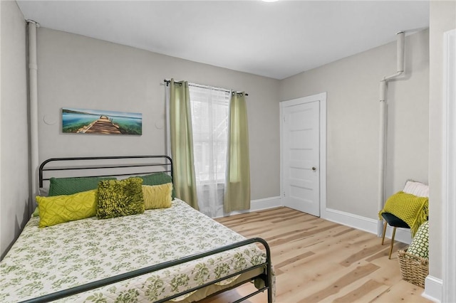 1413 Broad St, Providence, RI 02905 - bedroom featuring wood finished floors and baseboards