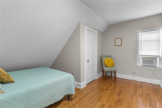 1413 Broad St, Providence, RI 02905 - bedroom featuring cooling unit, lofted ceiling, and light wood-style flooring