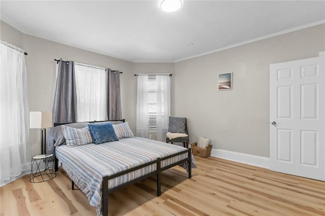 1413 Broad St, Providence, RI 02905 - bedroom with light wood-style floors and crown molding