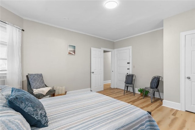 1413 Broad St, Providence, RI 02905 - bedroom featuring light wood-style flooring and ornamental molding