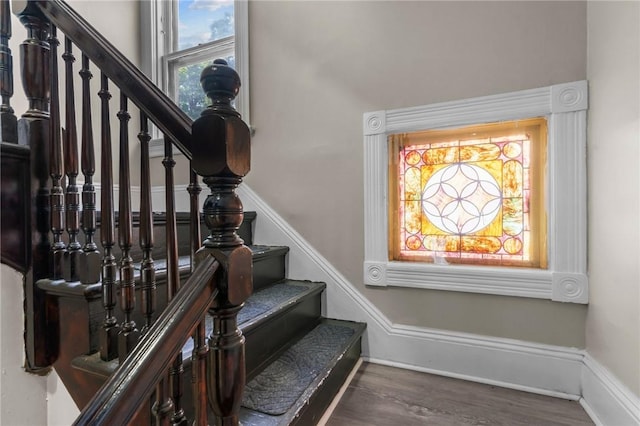 1413 Broad St, Providence, RI 02905 - stairs featuring wood finished floors and baseboards