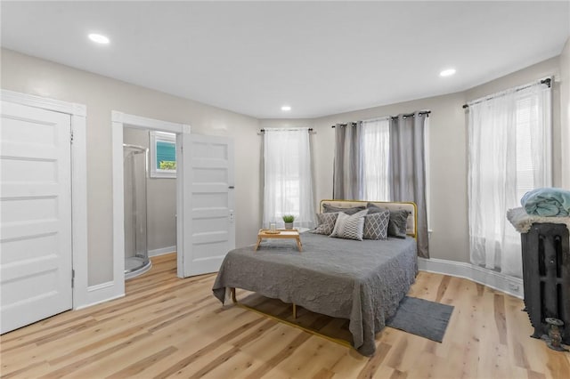 1413 Broad St, Providence, RI 02905 - bedroom with light wood finished floors, multiple windows, and recessed lighting