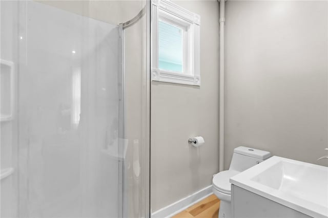 1413 Broad St, Providence, RI 02905 - full bath featuring a stall shower, vanity, and wood finished floors
