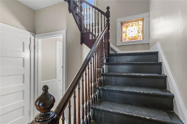 1413 Broad St, Providence, RI 02905 - stairs featuring a wainscoted wall