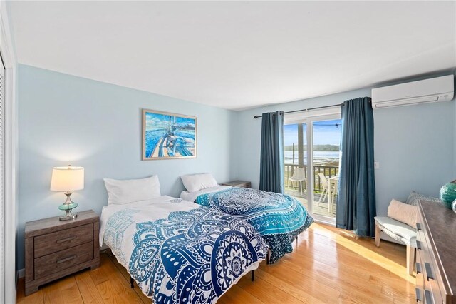 408 Atlantic Ave, Westerly, RI 02891 - bedroom with an AC wall unit, access to outside, and wood finished floors