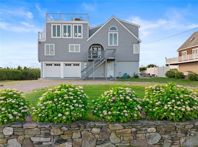 408 Atlantic Ave, Westerly, RI 02891 - view of front of home featuring a garage, stairway, and gravel driveway