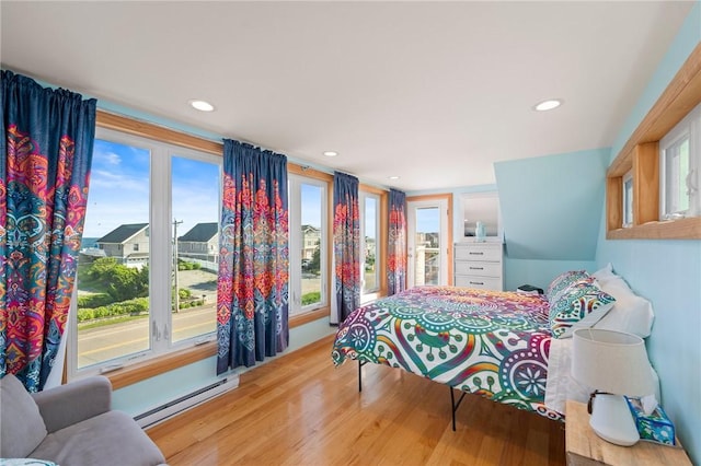 408 Atlantic Ave, Westerly, RI 02891 - bedroom with multiple windows, baseboard heating, wood finished floors, and recessed lighting