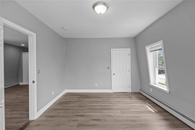 406 Cahill St, Providence, RI 02905 - unfurnished room featuring baseboard heating, wood finished floors, and a smoke detector