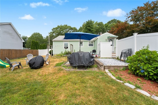 2 Glen Dr, Warwick, RI 02889 - rear view of house with a fenced backyard