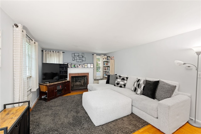 2 Glen Dr, Warwick, RI 02889 - living area featuring a brick fireplace and wood finished floors
