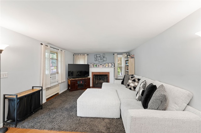 2 Glen Dr, Warwick, RI 02889 - living room featuring radiator heating unit, a brick fireplace, and carpet