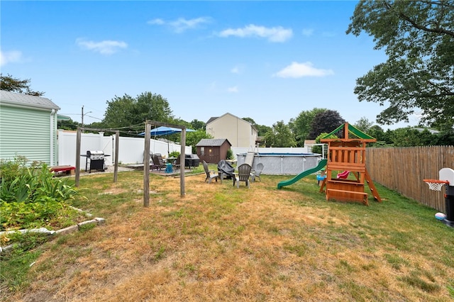 2 Glen Dr, Warwick, RI 02889 - fenced backyard with a playground and a storage unit