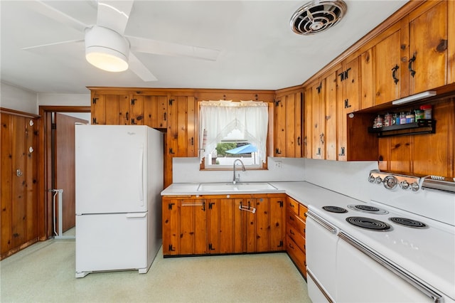 2 Glen Dr, Warwick, RI 02889 - kitchen featuring white appliances, brown cabinetry, ceiling fan, and light countertops