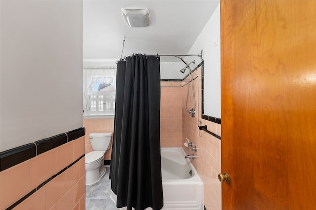 2 Glen Dr, Warwick, RI 02889 - bathroom featuring tile walls, shower / bath combo, and a wainscoted wall